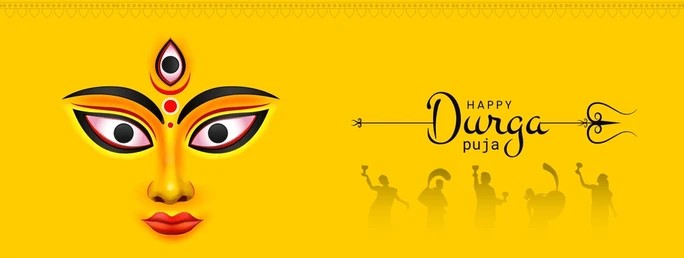 Illustration of the face of Goddess Durga on a golden background, with silhouettes of dancers celebrating Durga Puja